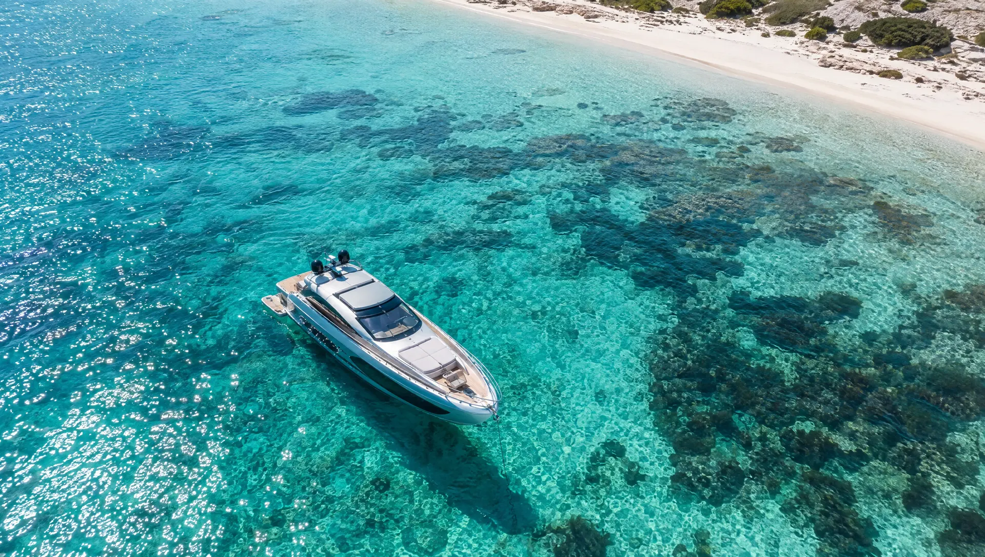 Motor yacht anchored in turquoise water off Formentera